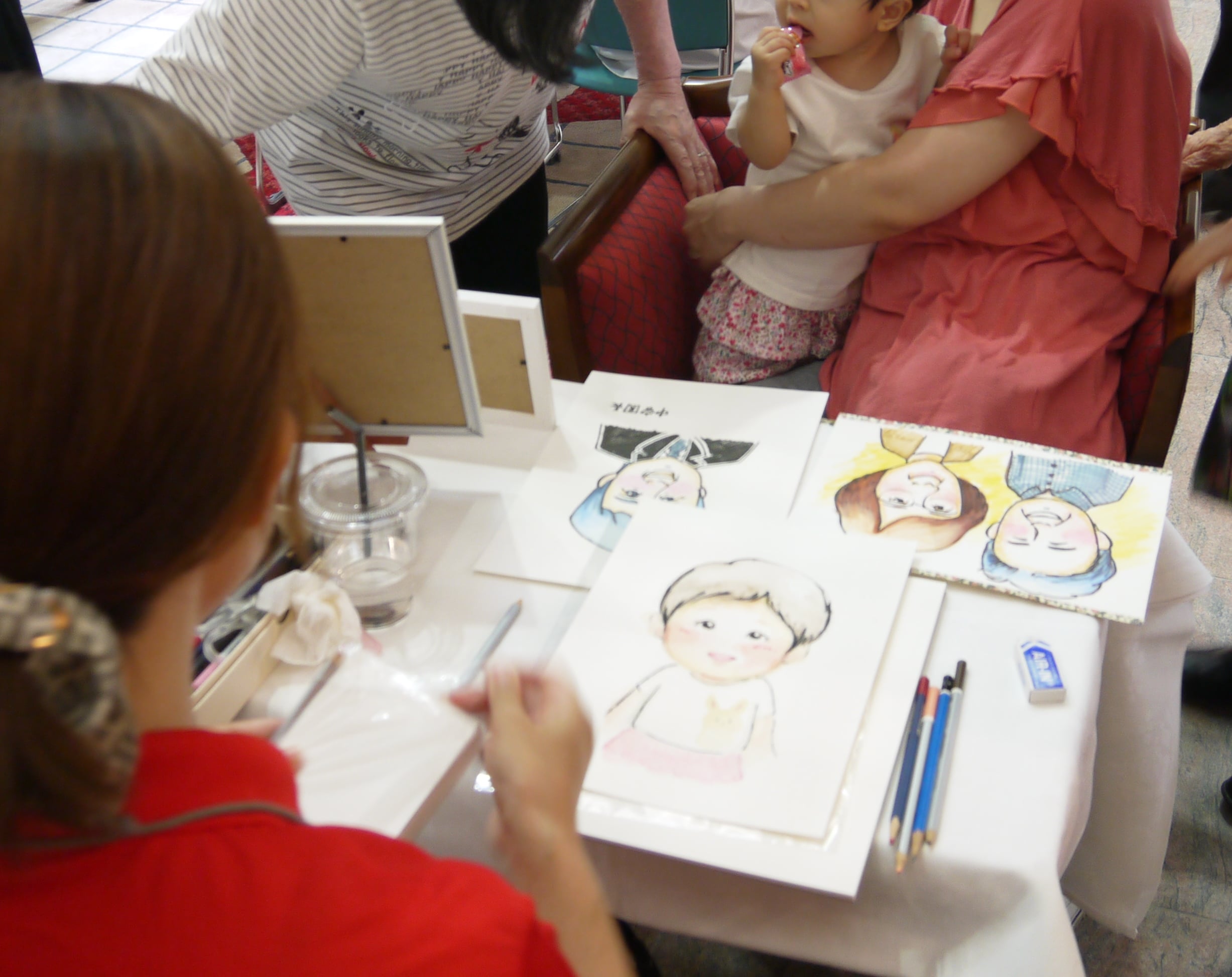 似顔絵コーナーと手作りグッズ販売